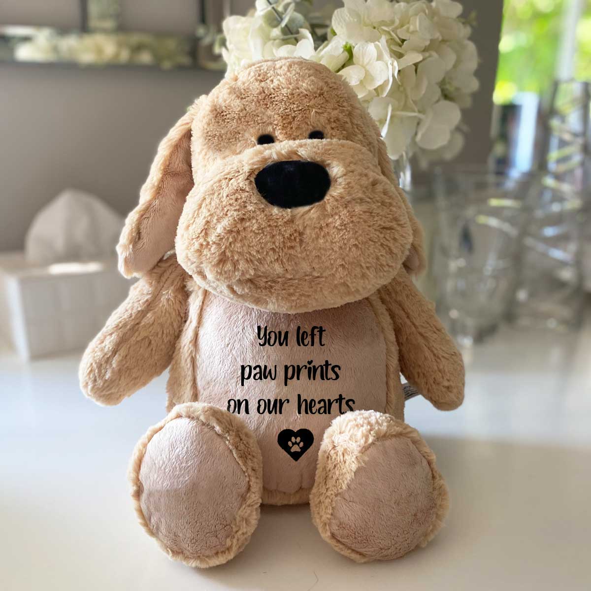 Comfort dog teddy shown with its embroidered message