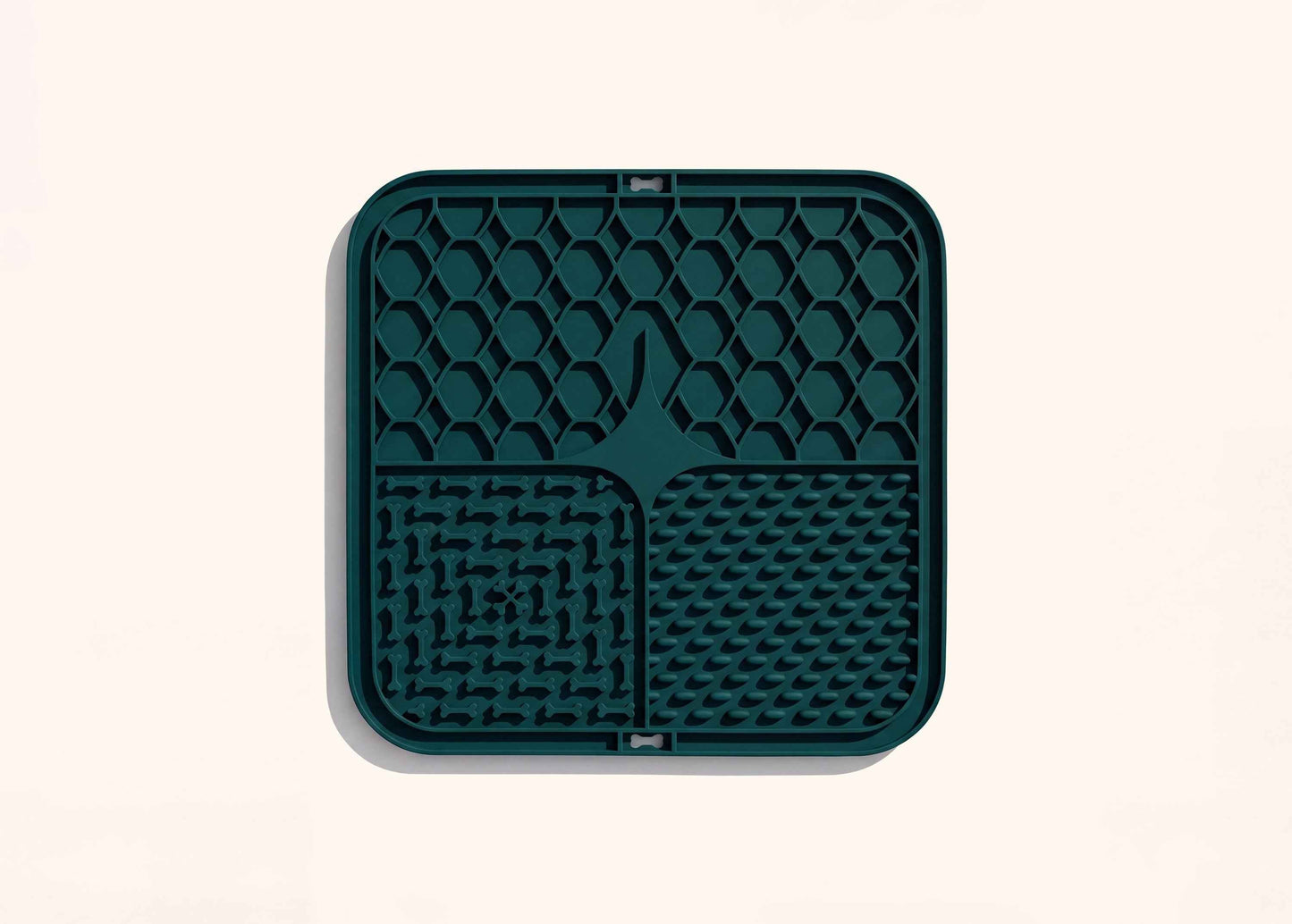 Top down view of the Superwild dog lick mat, four textured silicone sections inside a raised rim
