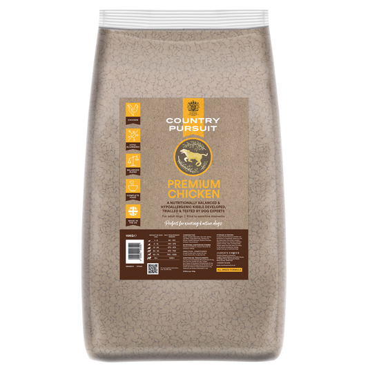 A 15kg bag of Country Pursuit Premium Chicken dry dog food showing the composition, analytical constituents and feeding guide printed on the pack