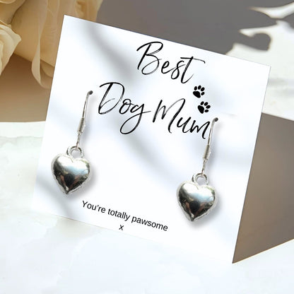 Best Dog Mum message card with paw prints and the words You're totally pawsome, holding a pair of silver plated puffed heart drop earrings.