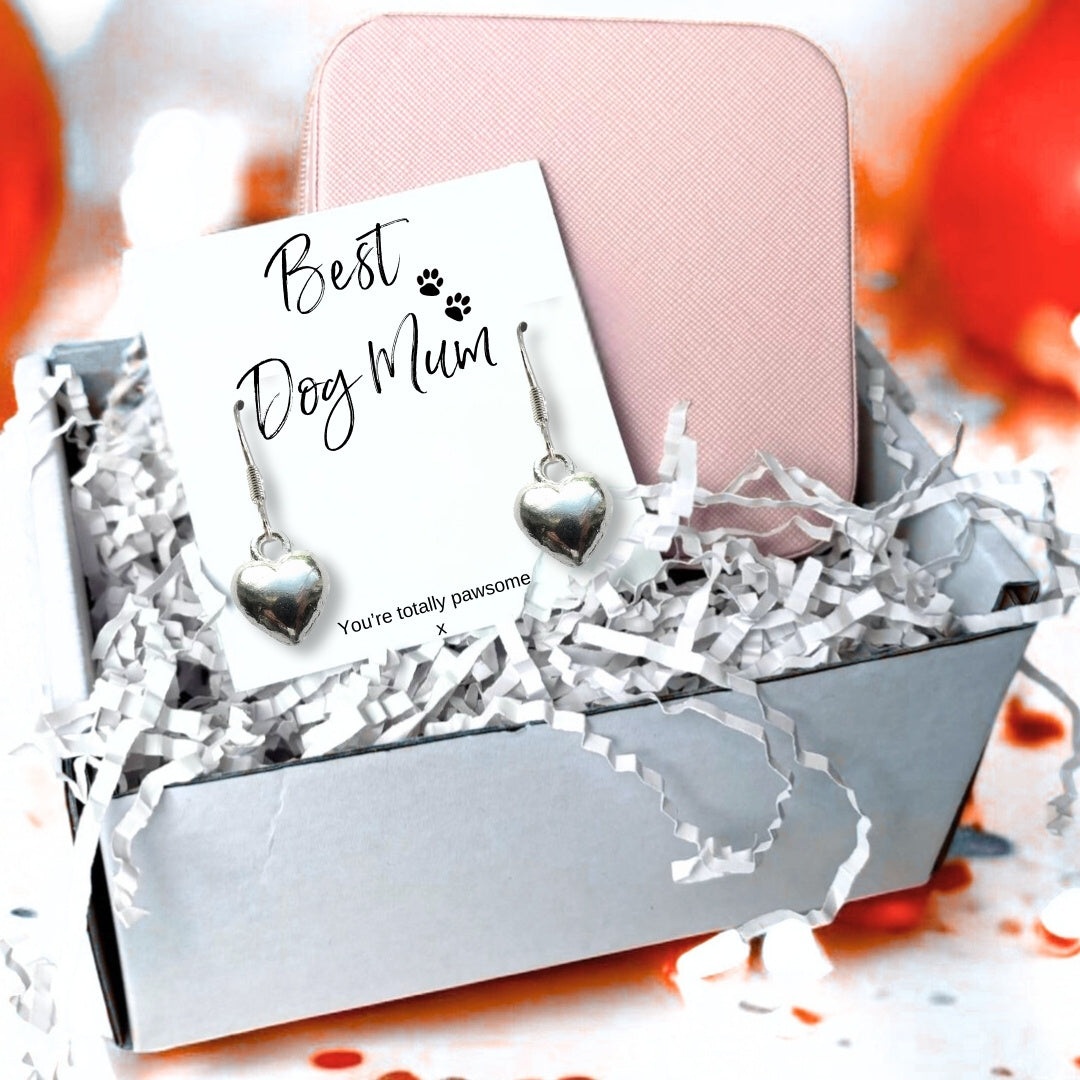 Silver plated puffed heart drop earrings on a Best Dog Mum card reading You're totally pawsome, presented in a gift box with a pink zip up jewellery case and shredded paper filler.