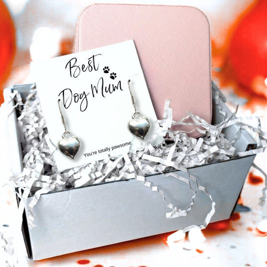 Silver plated puffed heart drop earrings on a Best Dog Mum card reading You're totally pawsome, presented in a gift box with a pink zip up jewellery case and shredded paper filler.