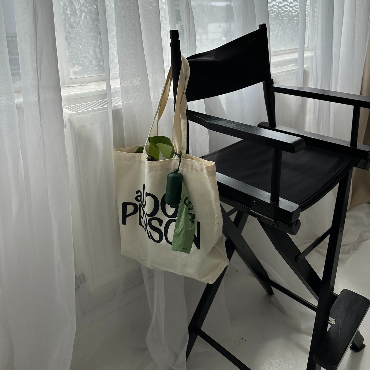 a Dog Person tote bag packed with dog walk essentials