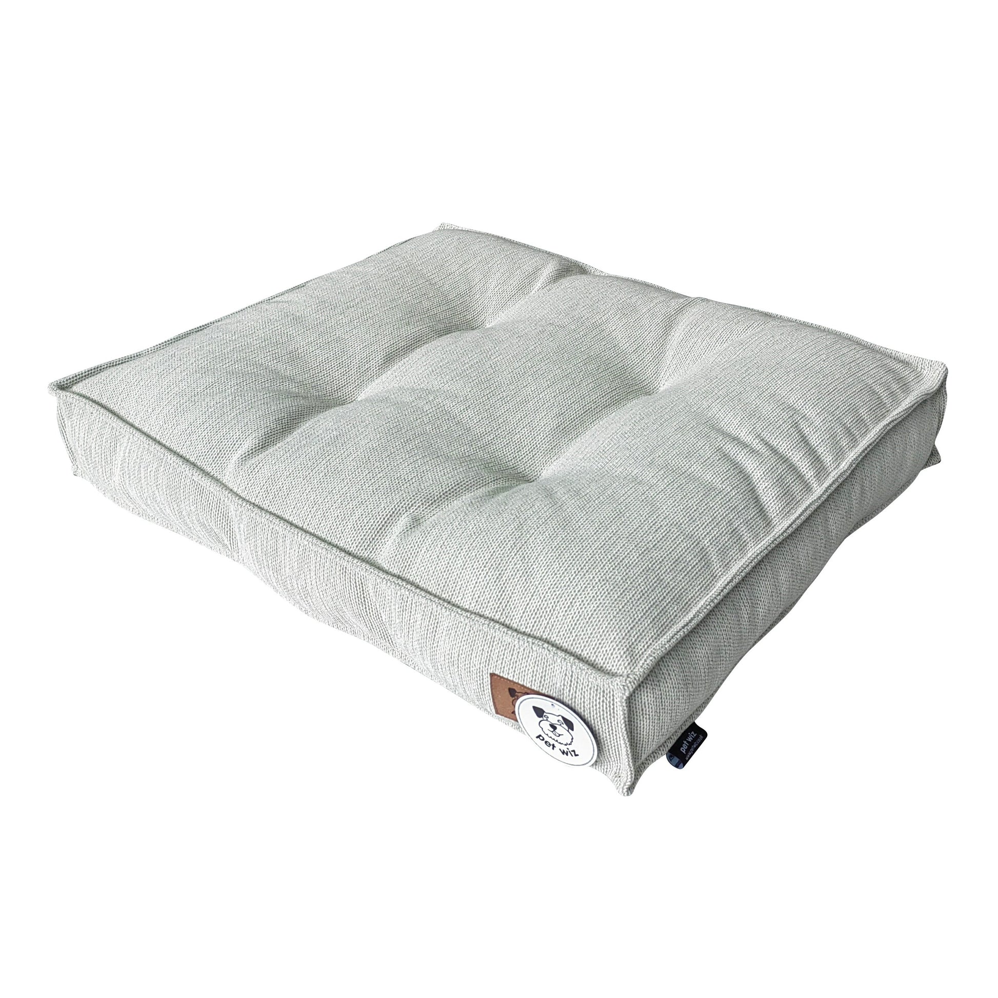 Pet Wiz padded dog bed shown from the side, with a soft cushioned sleeping surface