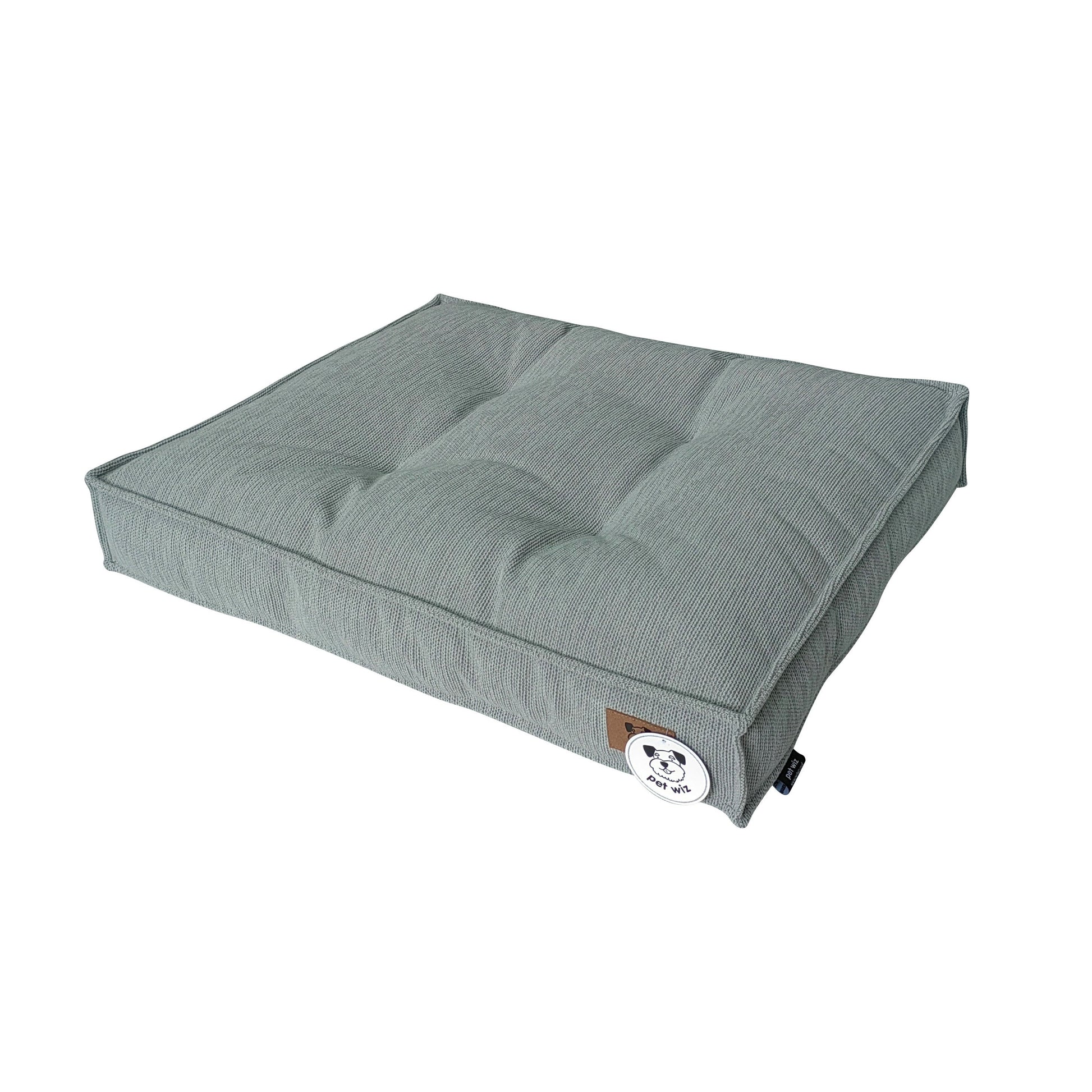 Light grey padded dog bed with removable cover, side view