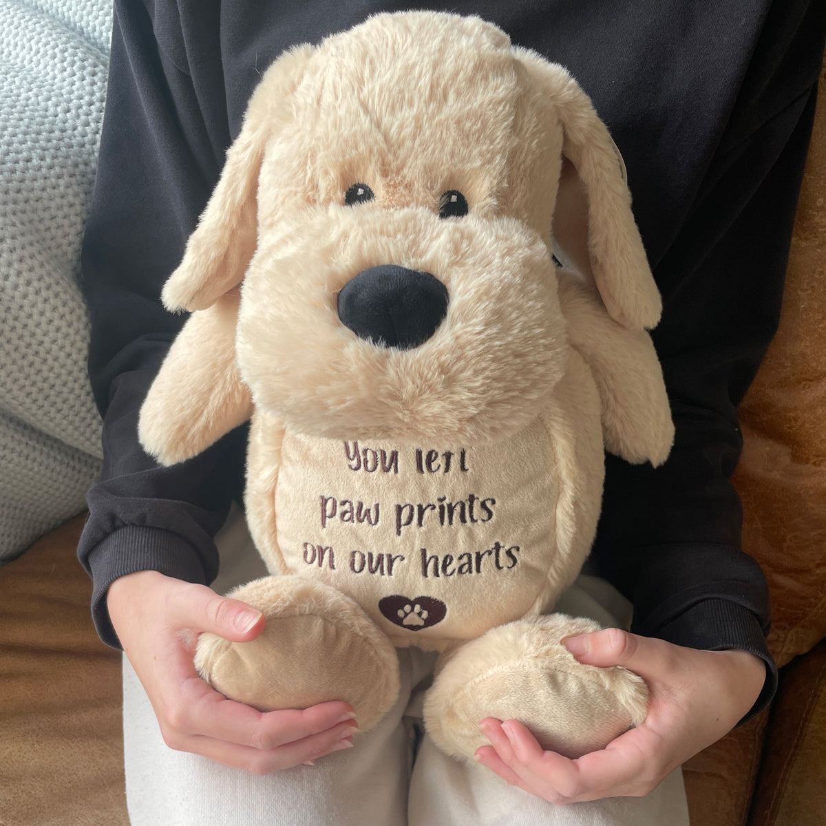Comfort dog teddy held as a pet loss keepsake