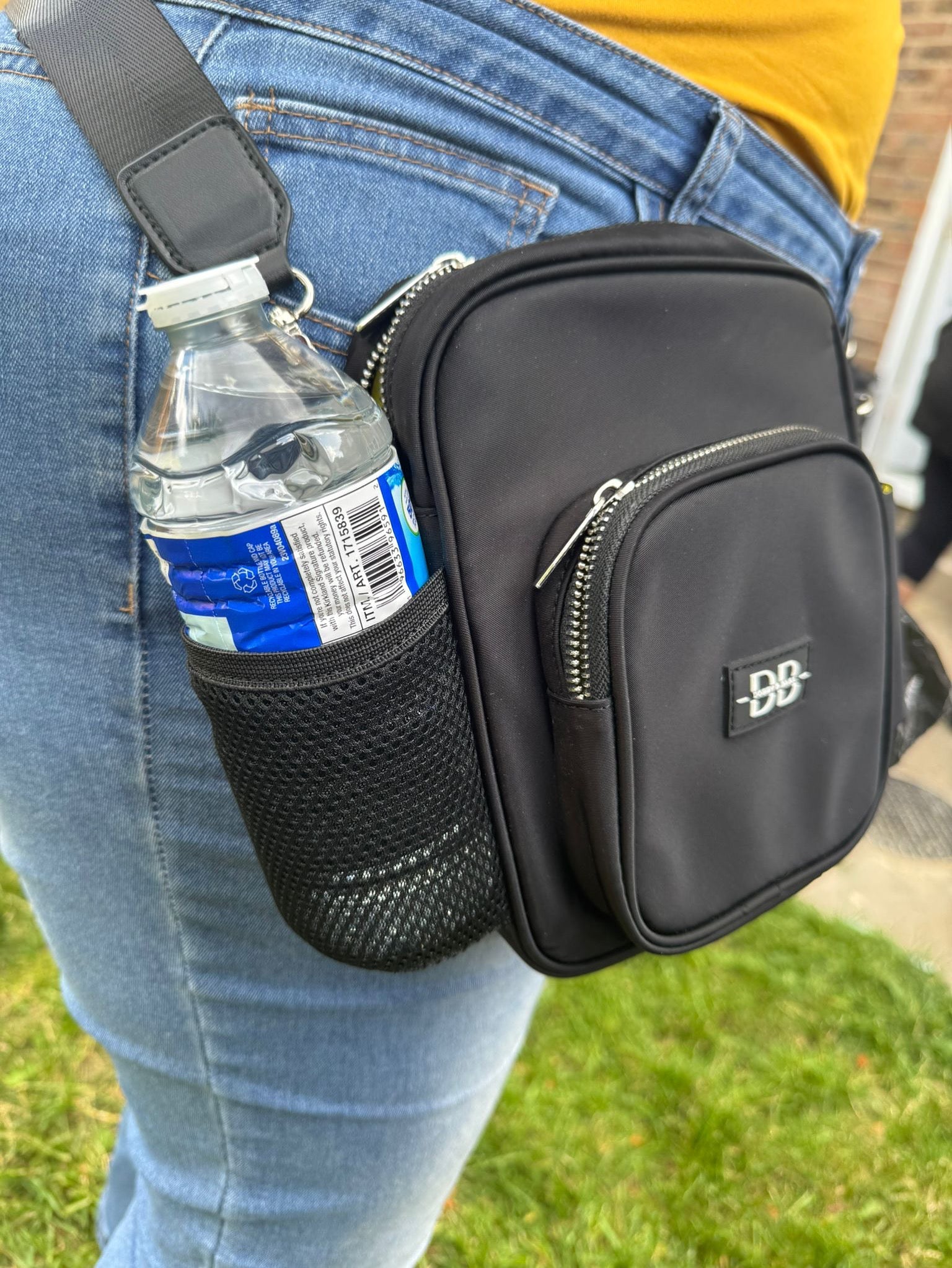 The OG worn at the hip in black, with a water bottle in the stretch mesh side pocket