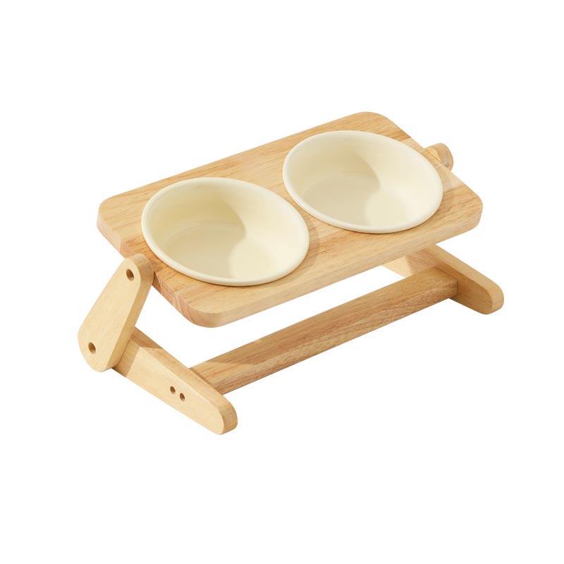 Duke & Milo adjustable wooden dog bowl stand in cream, holding two ceramic bowls