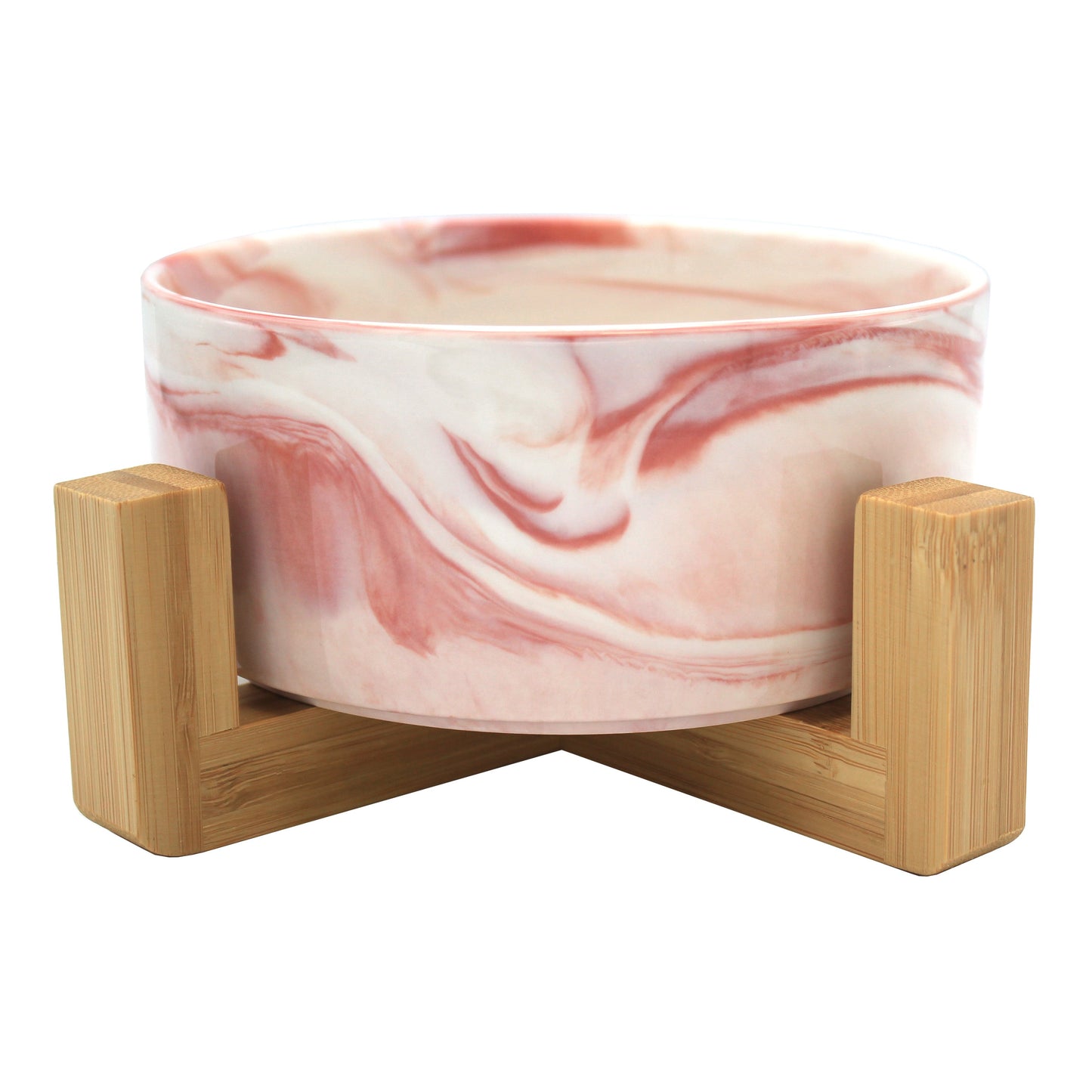 Duke & Milo raised ceramic dog bowl in marble pink, sitting in its bamboo stand