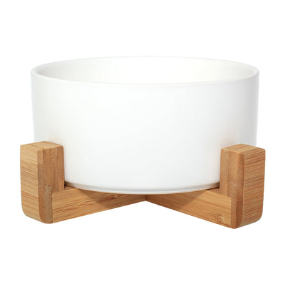 Duke & Milo raised ceramic dog bowl in white, sitting in its bamboo stand