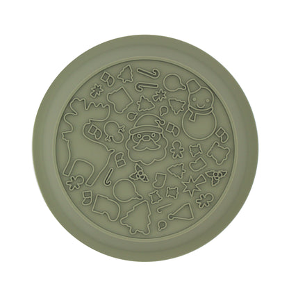 Lick mat side of the green festive dog bowl, covered in raised Christmas shapes