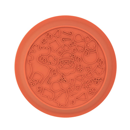 Lick mat side of the orange festive dog bowl with raised Christmas shapes