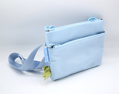Baby blue crossbody dog walking bag with adjustable shoulder strap
