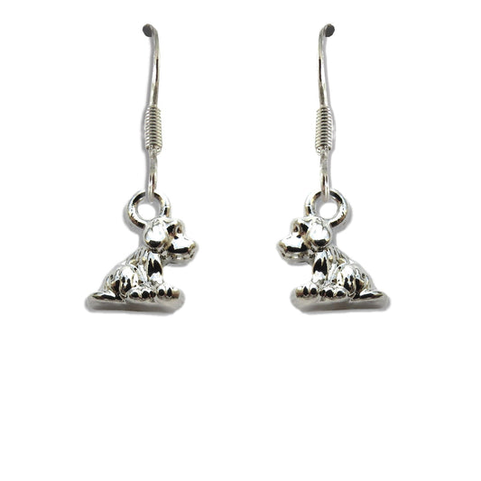 Pair of silver plated little dog drop earrings on fishhook wires, each charm shaped as a seated puppy, on a plain white background.