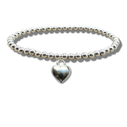 Silver plated beads and puff heart charm on the stretch elastic bracelet, shown in detail