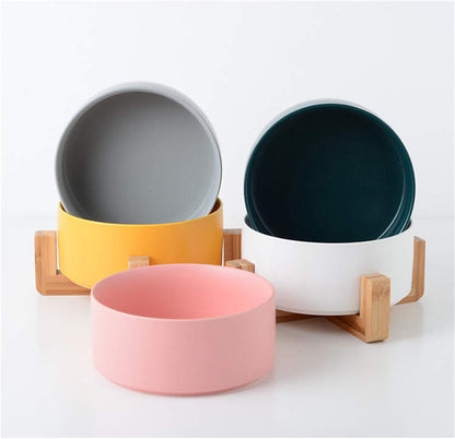 Grey, jade, white and pink ceramic dog bowls with bamboo stands, from Duke & Milo
