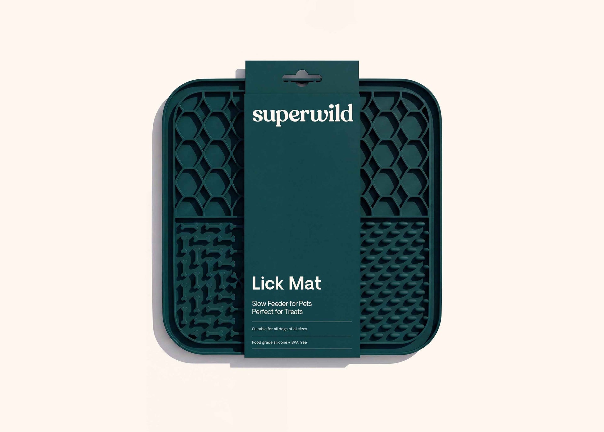 Superwild lick mat for dogs in its retail sleeve, dark green silicone mat with four textured feeding sections