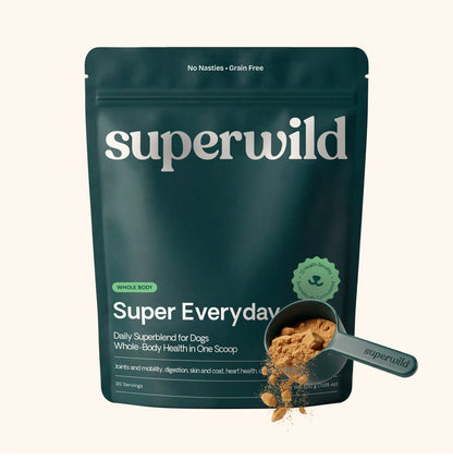 Superwild Super Everyday daily supplement powder for dogs, dark green resealable pouch with a scoop of beef broth flavoured powder